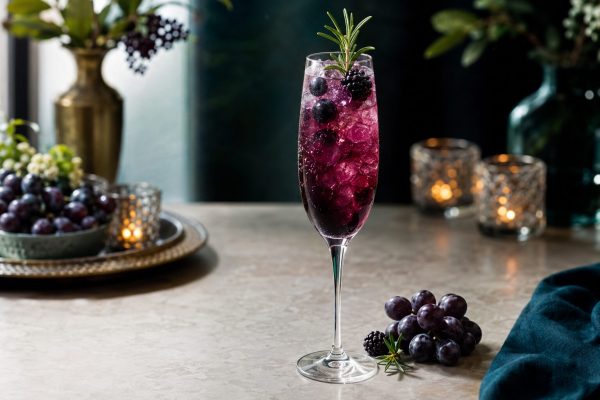 Concord Grape Rosemary Sparkler tea mocktail with grapes and rosemary