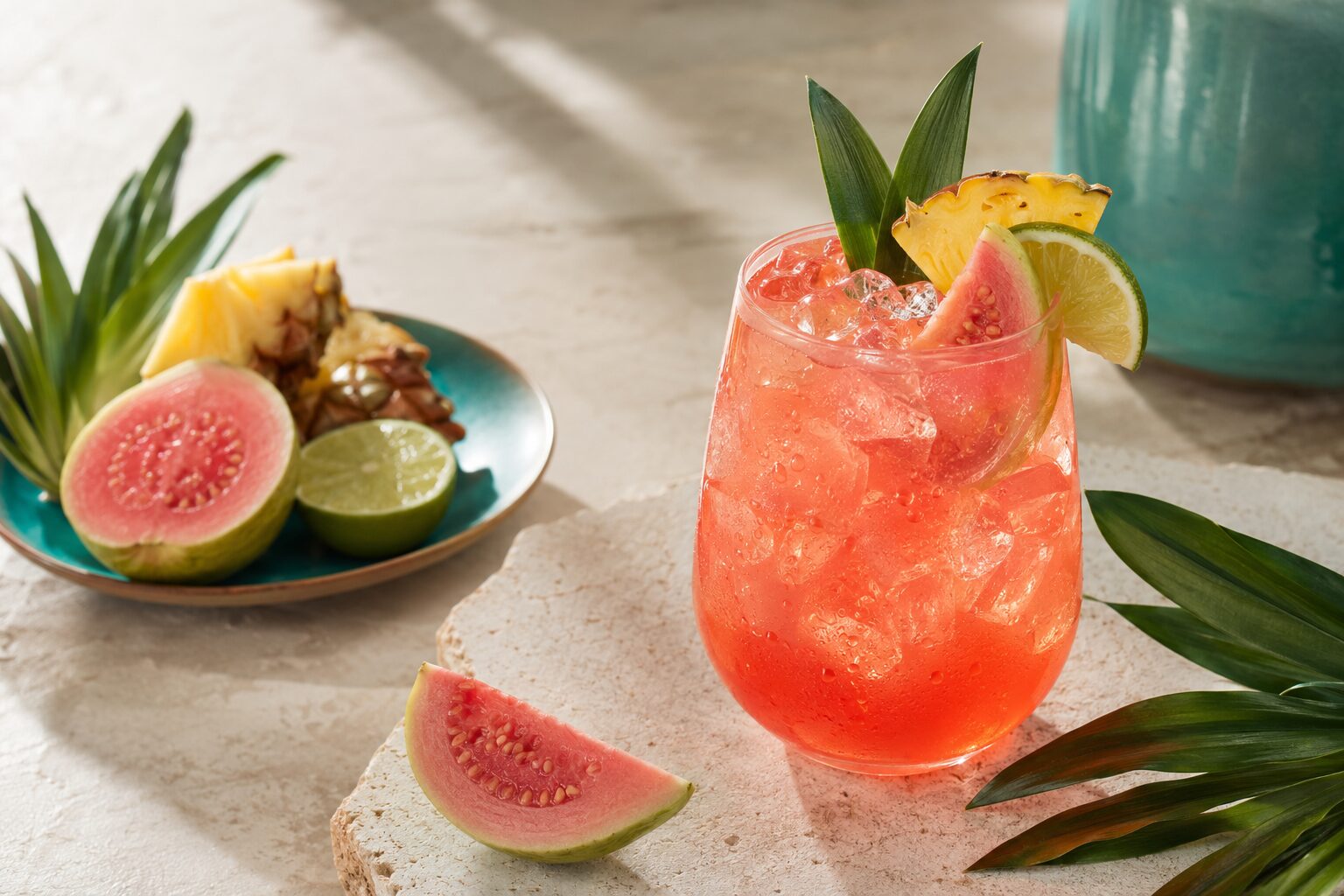 Coral Guava Tea Cooler Tropical Punch Guava Cooler tea mocktail with pink guava, pineapple and lime